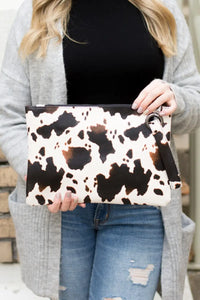 COW PRINT OVERSIZED CLUTCH Uncommon Reign